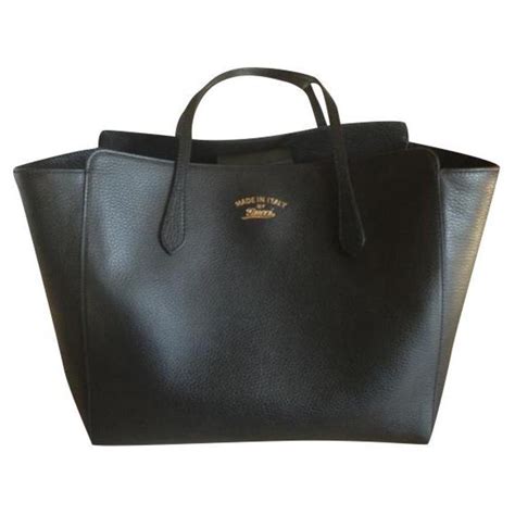 large black gucci tote|More.